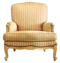 Old and stained Victorian style chair with striped fabric