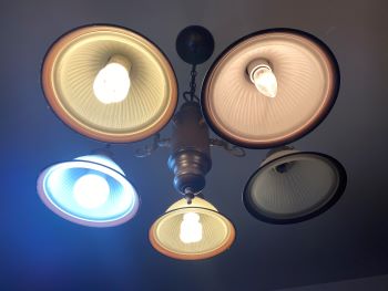 Overhead dining light that has 4 different light bulbs