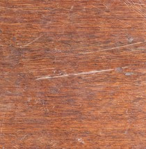 Brown hardwood floor with scratches
